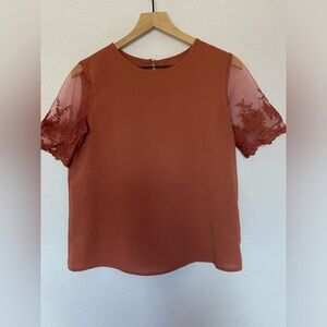 Rust boxy blouse with lace sleeves